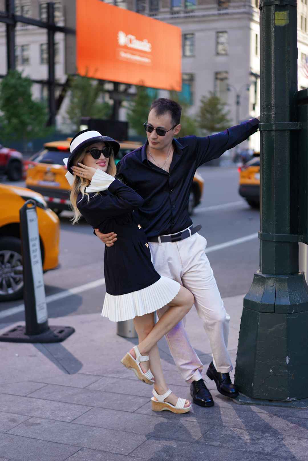 Couple sharing a playful moment on a Manhattan street